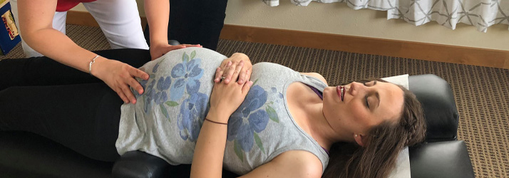 Chiropractor Appleton WI Kate Williams Adjusting Pregnant Client